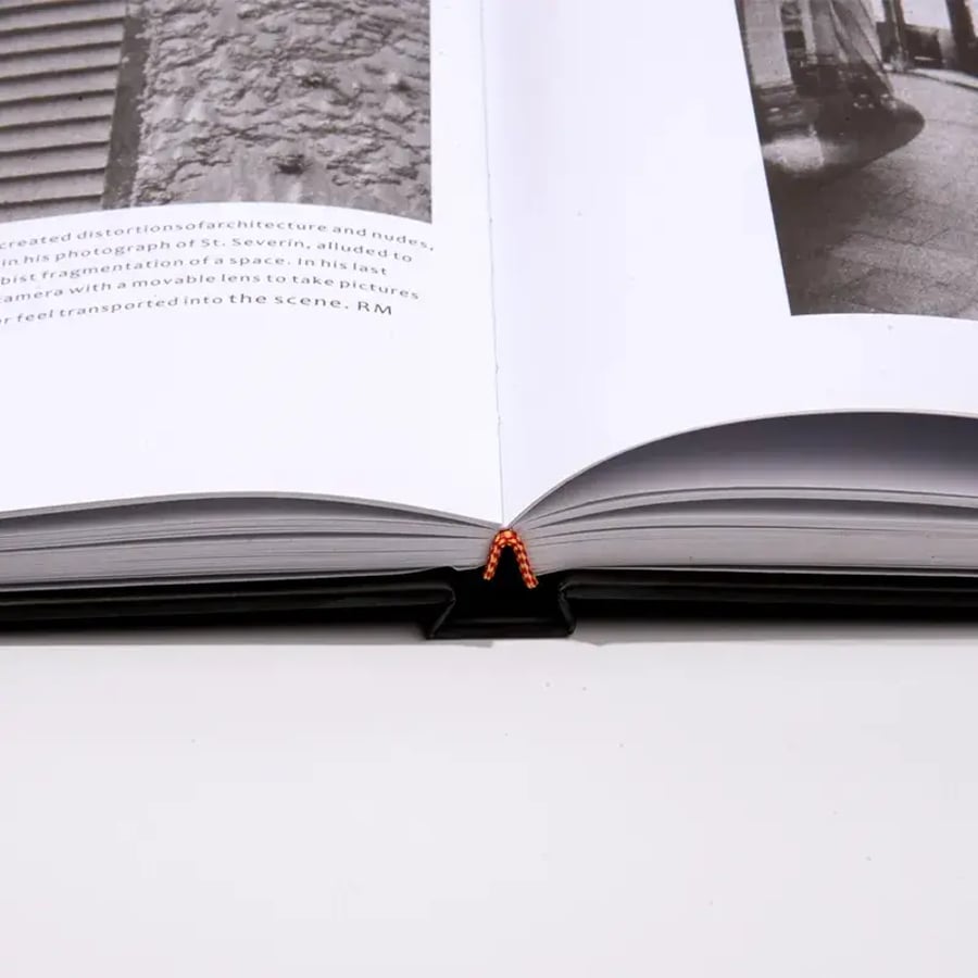 Hardcover book with lay flat design, thick pages, and sewn binding