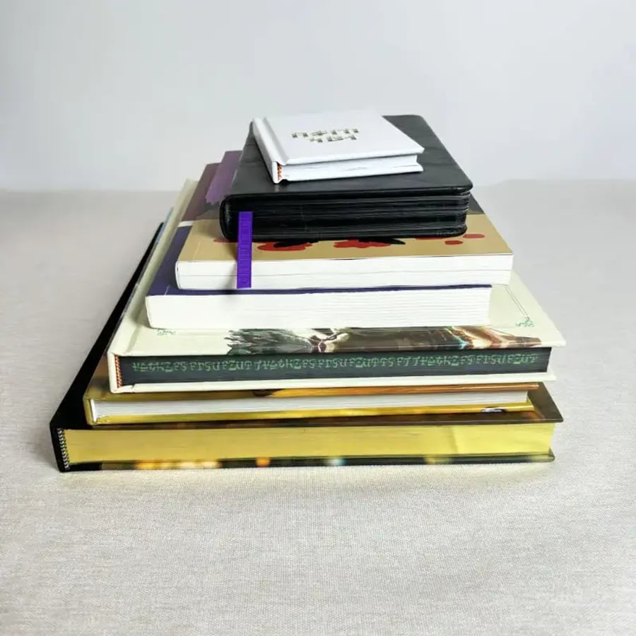 Hardcover books with diverse finishes and binding techniques