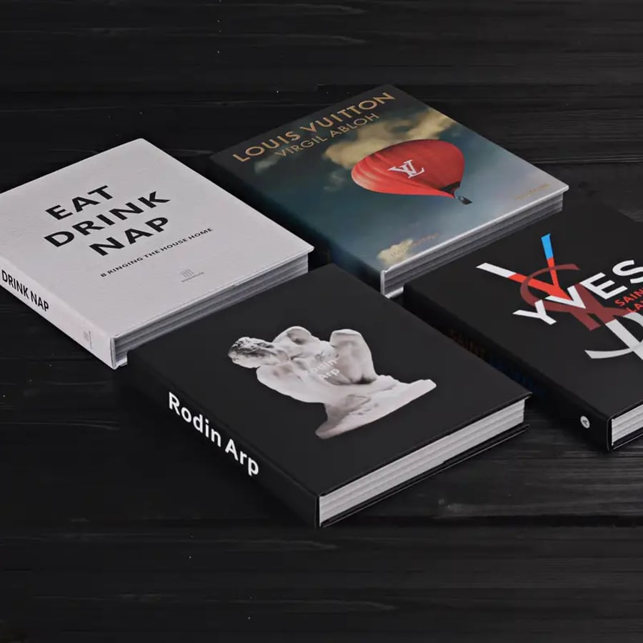 Artistic lay flat coffee table book on table