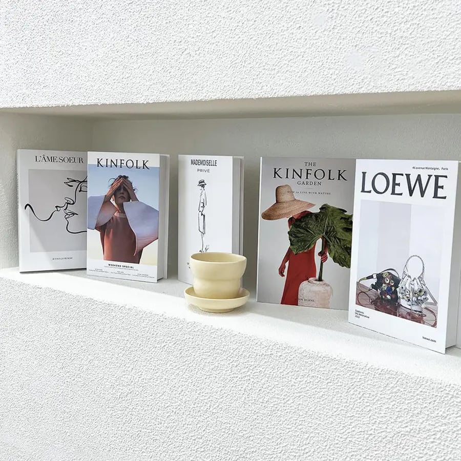 Fashion themed coffee table books on shelf