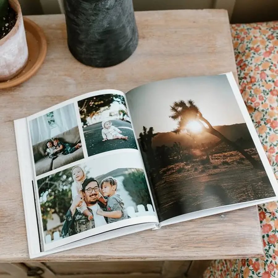 Glossy photo coffee table book on wooden surface
