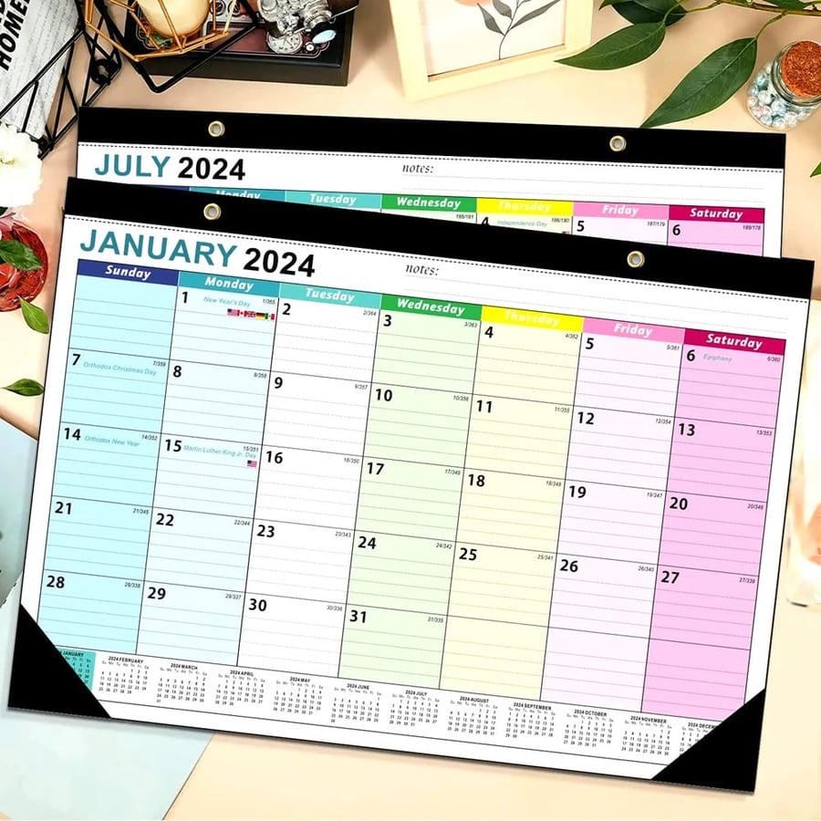 Large format wall planner with laminated monthly sheets
