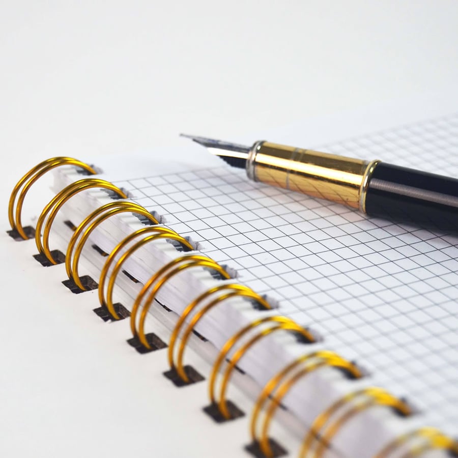 Wire O bound notebook with gold coil and smooth writing paper