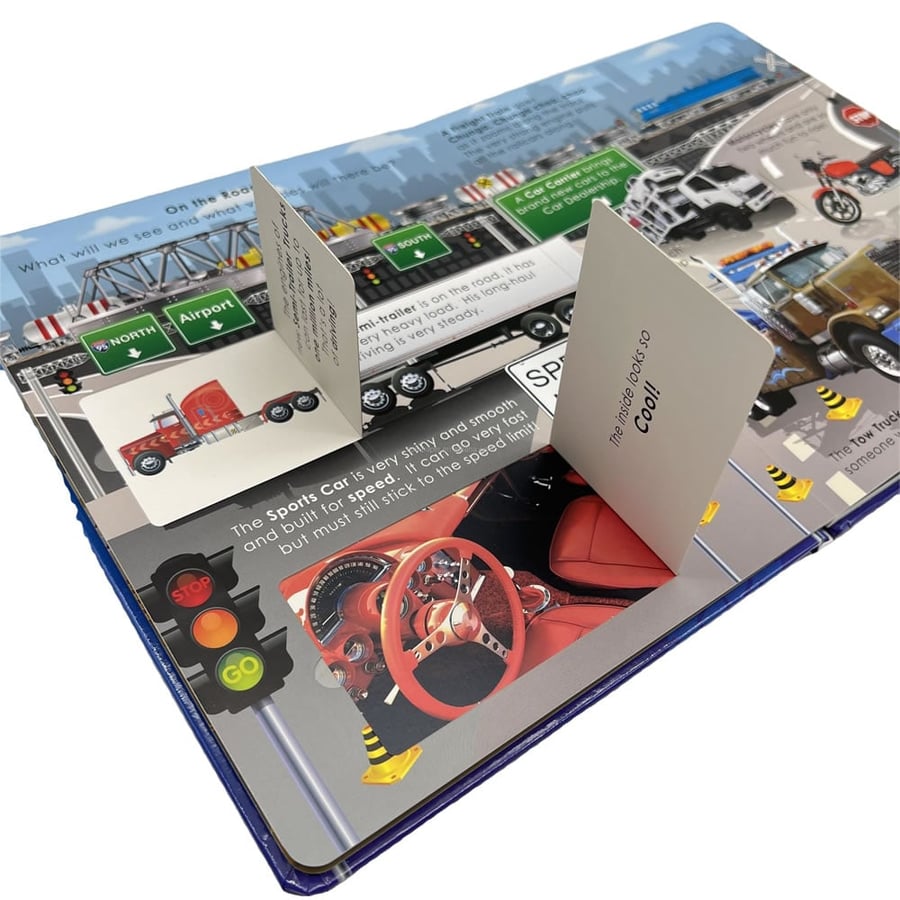 3D road-themed pop-up book with lift-the-flap vehicle elements.