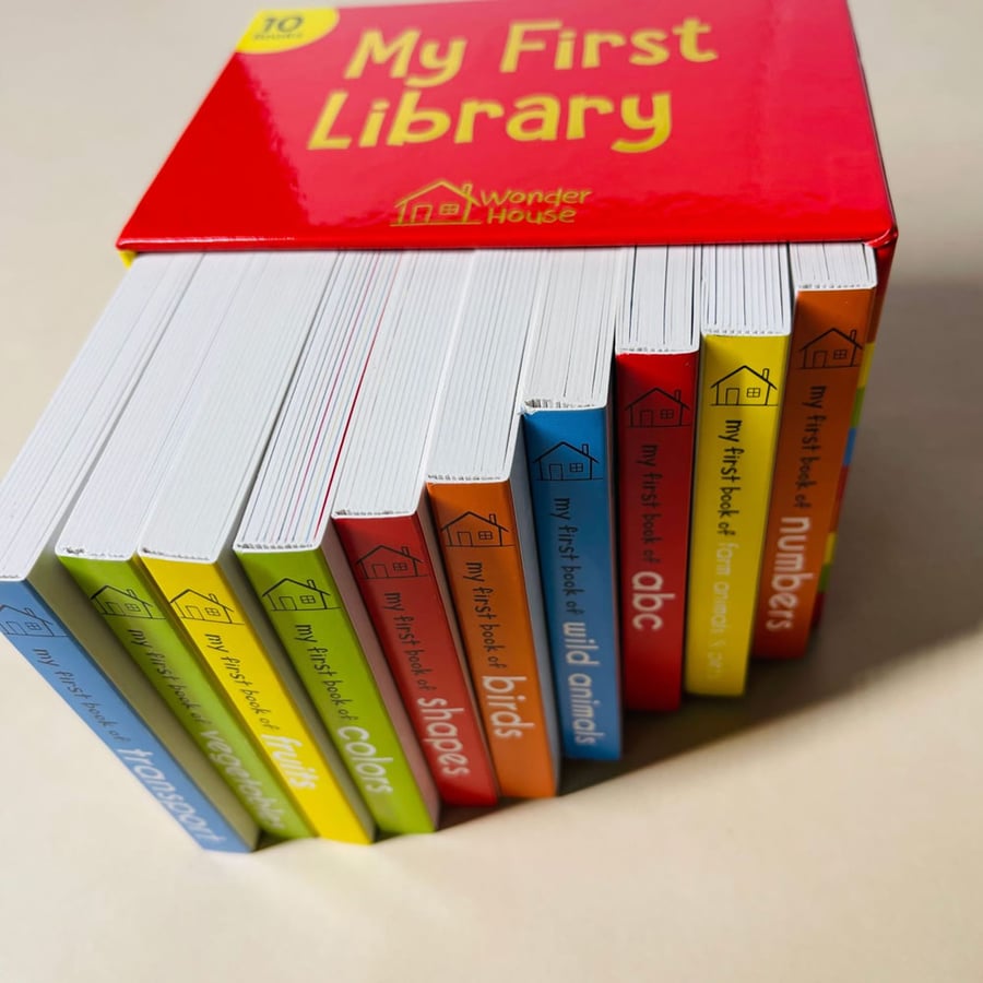 Colorful board book set with sturdy spines arranged in a library box.