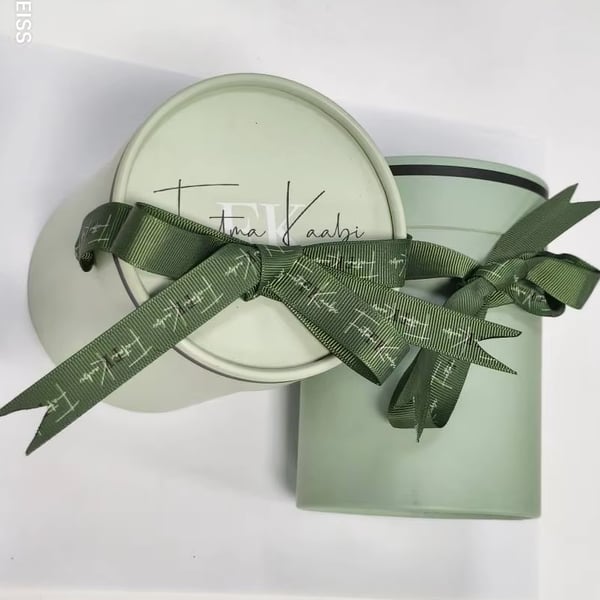 Custom Luxury Round Cylindrical Cardboard Box for Perfume Corrugated Board with Sponge Liner Decorative Ribbon Elegant Packaging